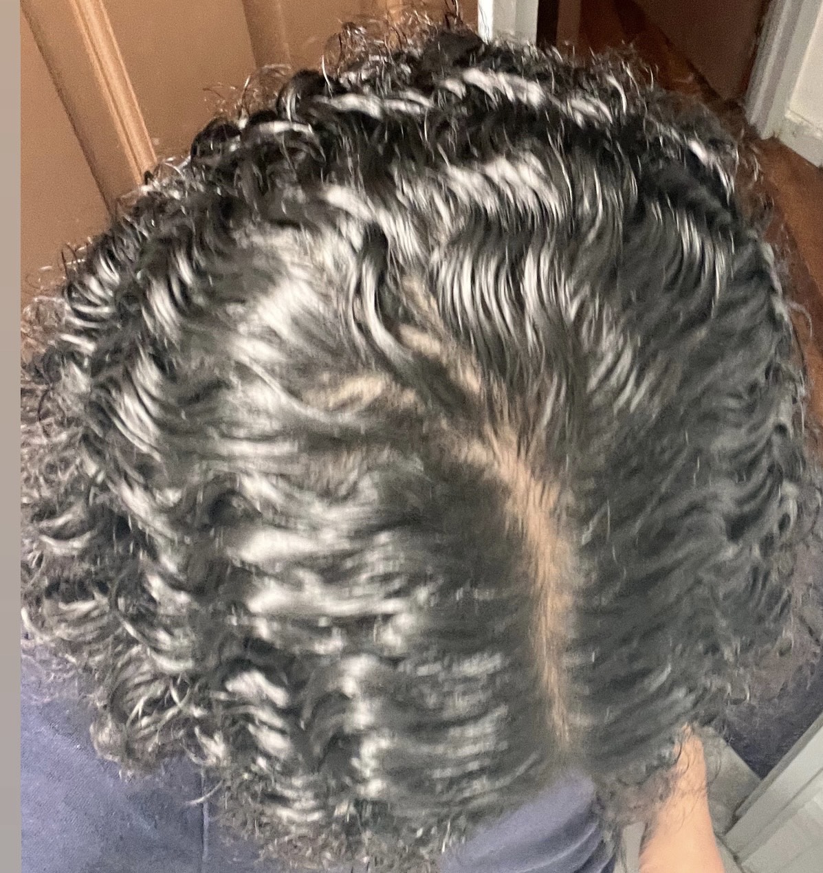 Top view of Senz's shiny, defined curls after use