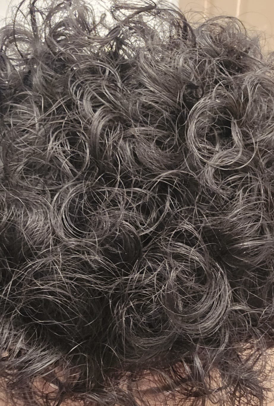 Elias's curls before using the Curl Nourishing Oil