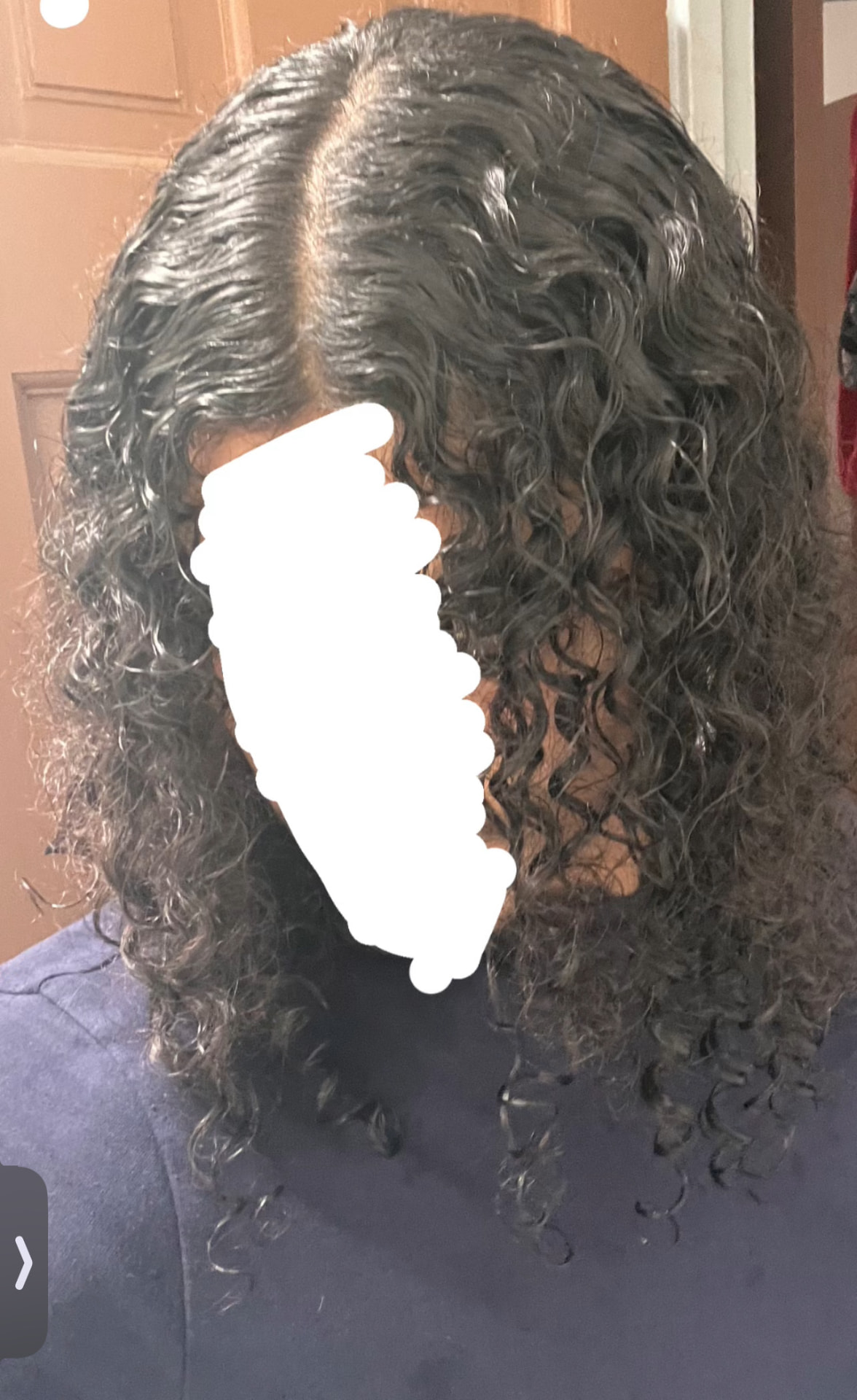 Close-up of Senz's defined, moisturized curls after use