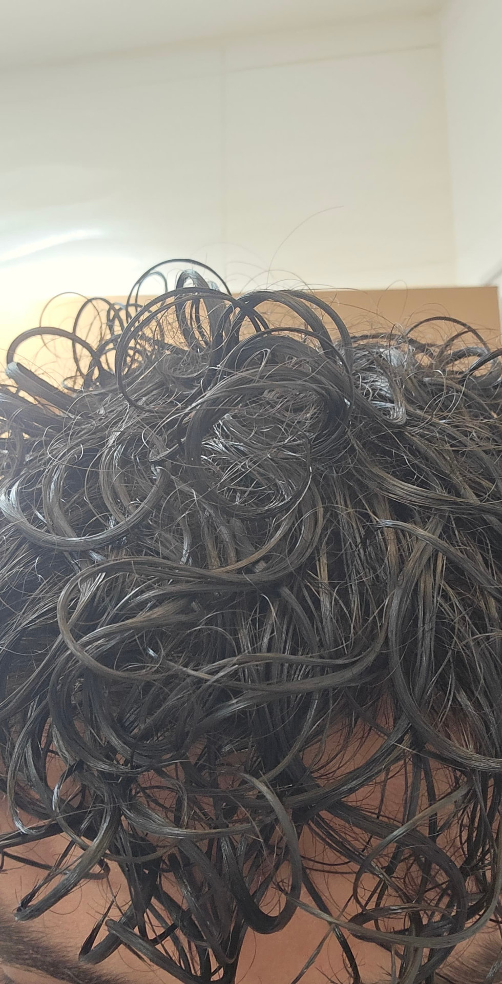 Elias's defined curls after using the Curl Nourishing Oil